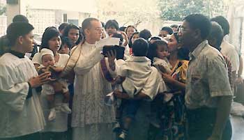 Fr. Abraham performing 33 baptisms