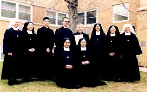 Fr Couture, with the Asian Sisters, Rev. Fr. Vin Son,  and Dominic Vu, a Vietnamese seminarian