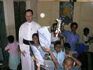 priest with orphans