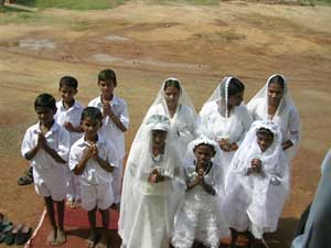 the orphan children wait outside the church for their baptism