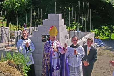 Bishop Fellay blesses corner plaque